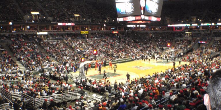 Live basketball game in an indoor arena between Philadelphia 76ers and Milwaukee Bucks.
