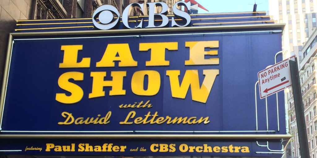 David Lettermans Late Show marquee sign on Broadway, featuring CBS logo and Paul Shaffers orchestra.