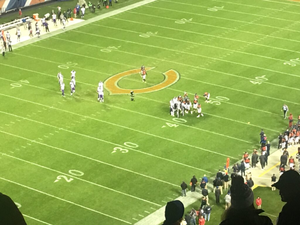 Evening NFL game, Minnesota Vikings vs. Chicago Bears, viewed from high-angle stadium seat.