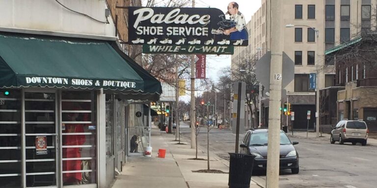Vintage Palace Shoe Service storefront on a peaceful downtown street in Rockford, Illinois.